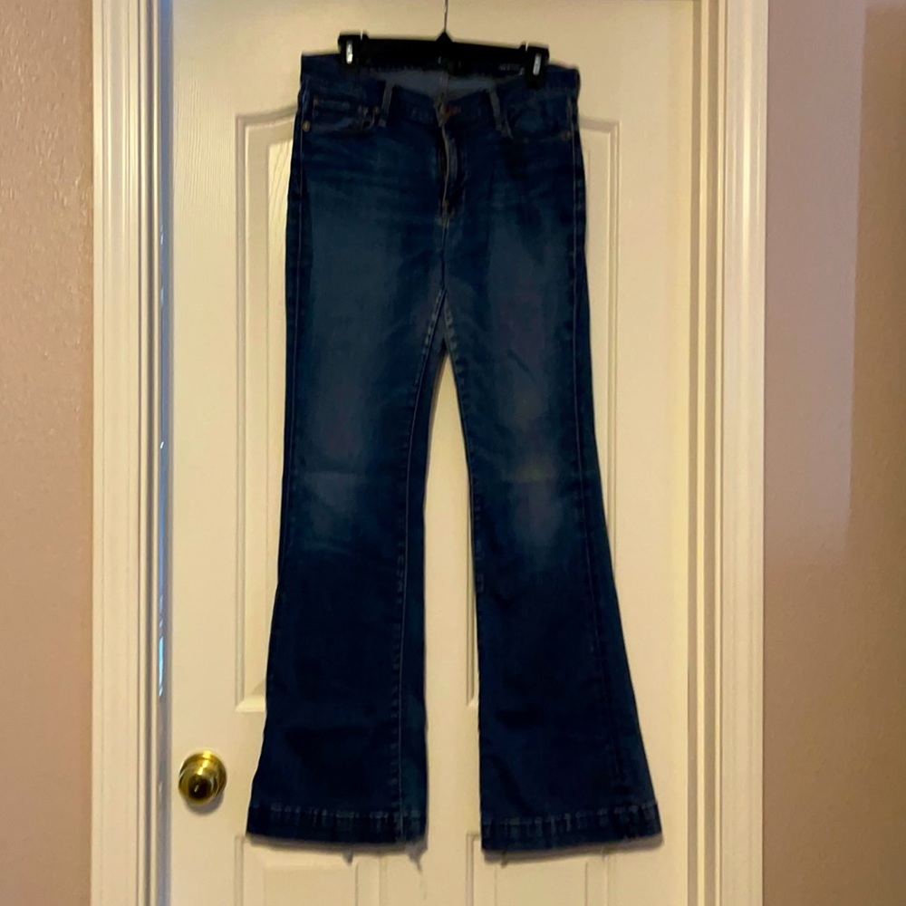 Lucky Brand flare bottom jeans.  Worn but no holes.